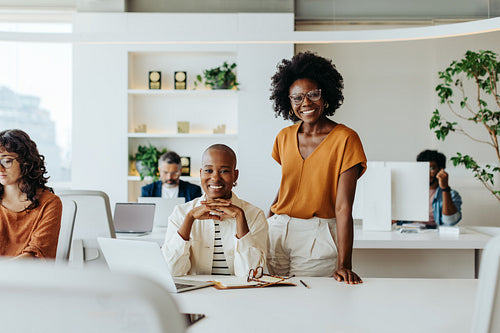 Creative female professionals collaborating at a professional office table
