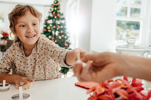 Little girl making cookies for Christmas.