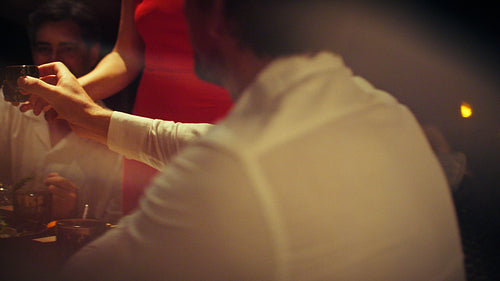 Happy family and friends walking to dinner at a luxury resort