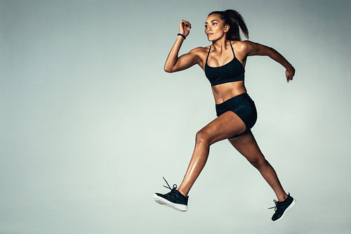 Hispanic female model doing running exercise