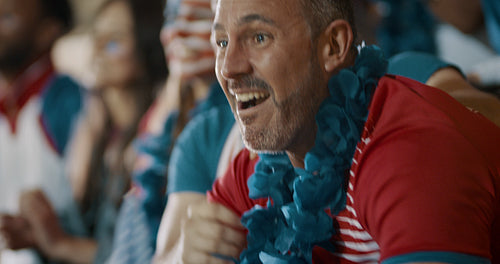 Excited American soccer fans celebrating victory