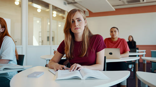 Smiling student attending a lecture