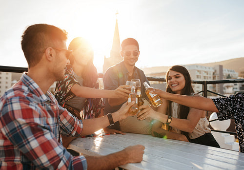Group of friends enjoying party with drinks