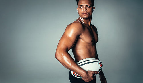 African male model with rugby ball
