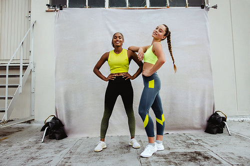 Portrait of two fitness females on rooftop