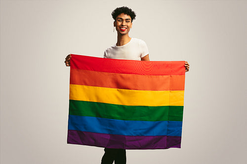 Man holding lgbtq flag