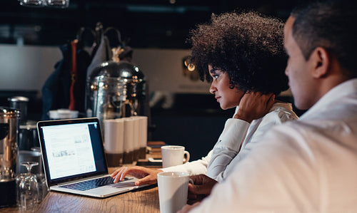 Business people working late on laptop