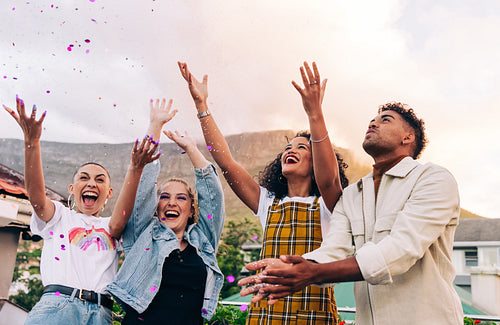 Friends enjoying a party on a rooftop