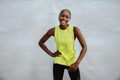 Smiling african woman in sportswear