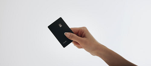 Premium black credit card mockup in minimalist white background