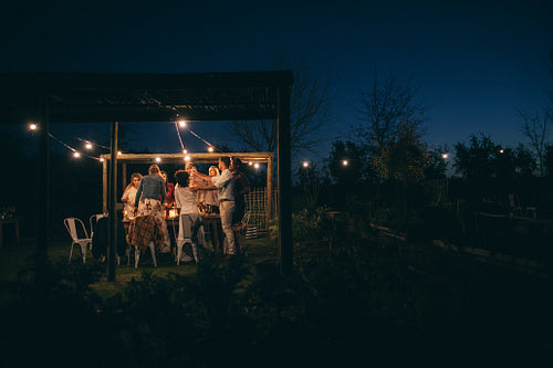 Group of people having a party at night