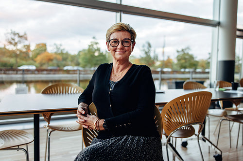 Successful senior businesswoman in office