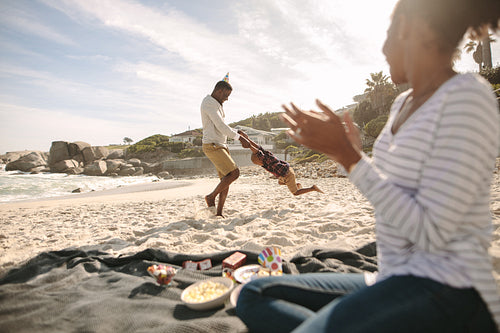 Happy family enjoying themselves on the beach