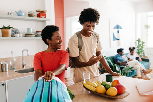A mother and son's morning routine in the kitchen