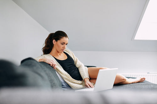 Relaxed young woman working from home