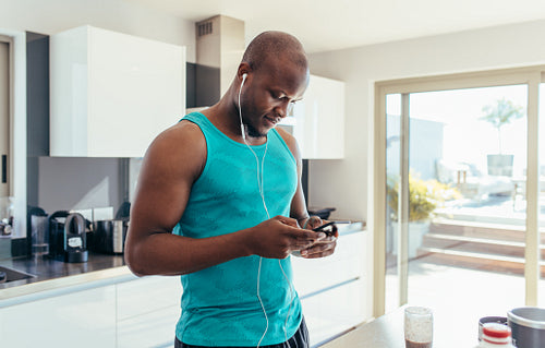 Man enjoying music at the breakfast table