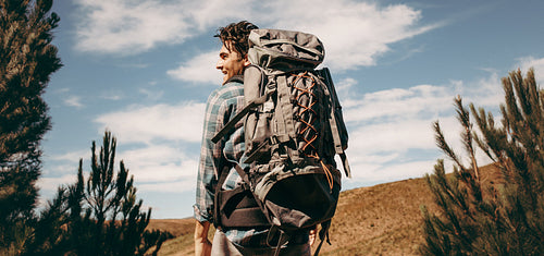 Man with backpack going on a camping
