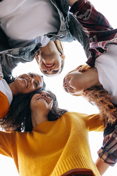 Group of female friends in a huddle