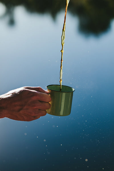 Close up of a hand holding a coffee mug