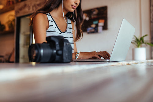 Woman working on laptop computer at home