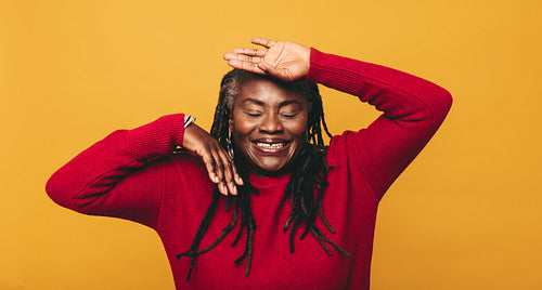 Mature woman having fun in the studio