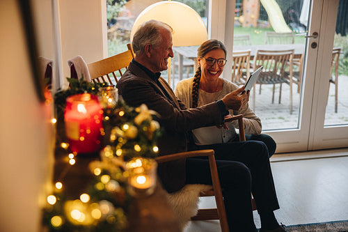 Senior couple video calling family on Christmas