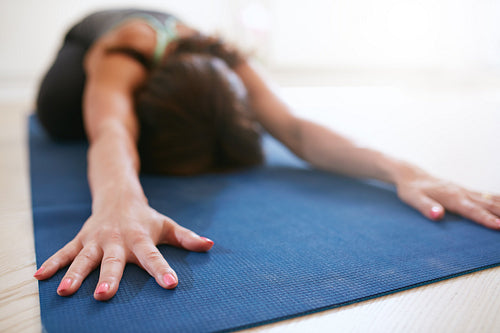 Fitness woman doing balasana yoga