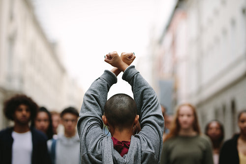 Woman protesting at a strike with her hands crossed