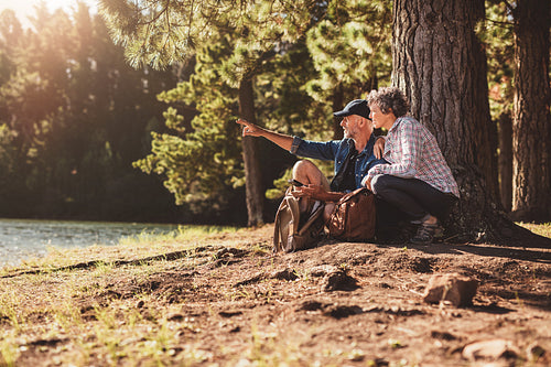 Senior man and woman on a hike in nature