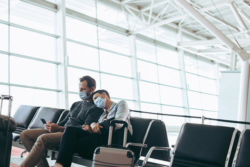Couple waiting for delayed flight at airport