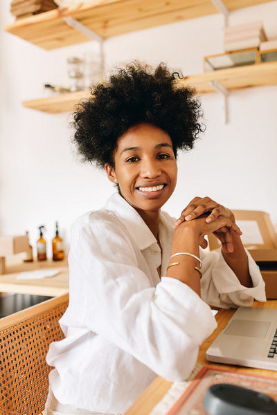 Smiling e-commerce business owner in studio