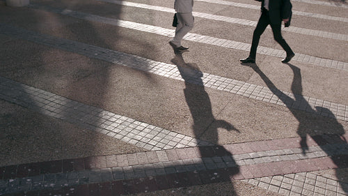 People in hurry using mobile phones while commuting to office