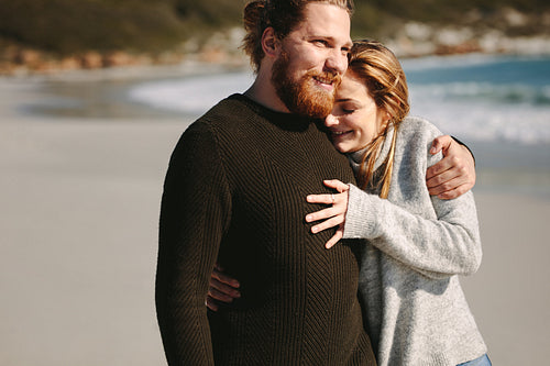 Loving couple standing at the beach