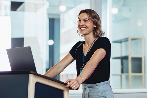 Businesswoman standing at podium