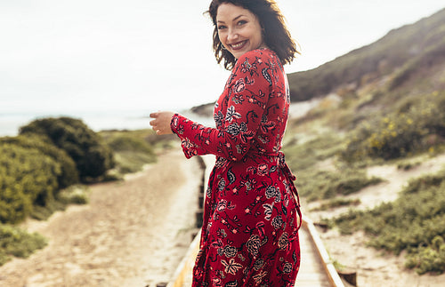 Beautiful woman walking at the seaside