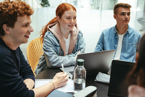 Group of friends working on a college assignment