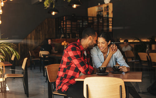 Beautiful couple in love in a coffee shop