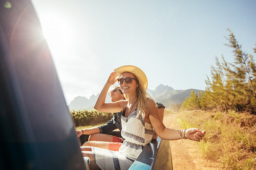 Beautiful woman in the back of truck with friends