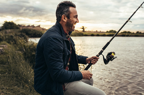 Man enjoying fishing near a lake