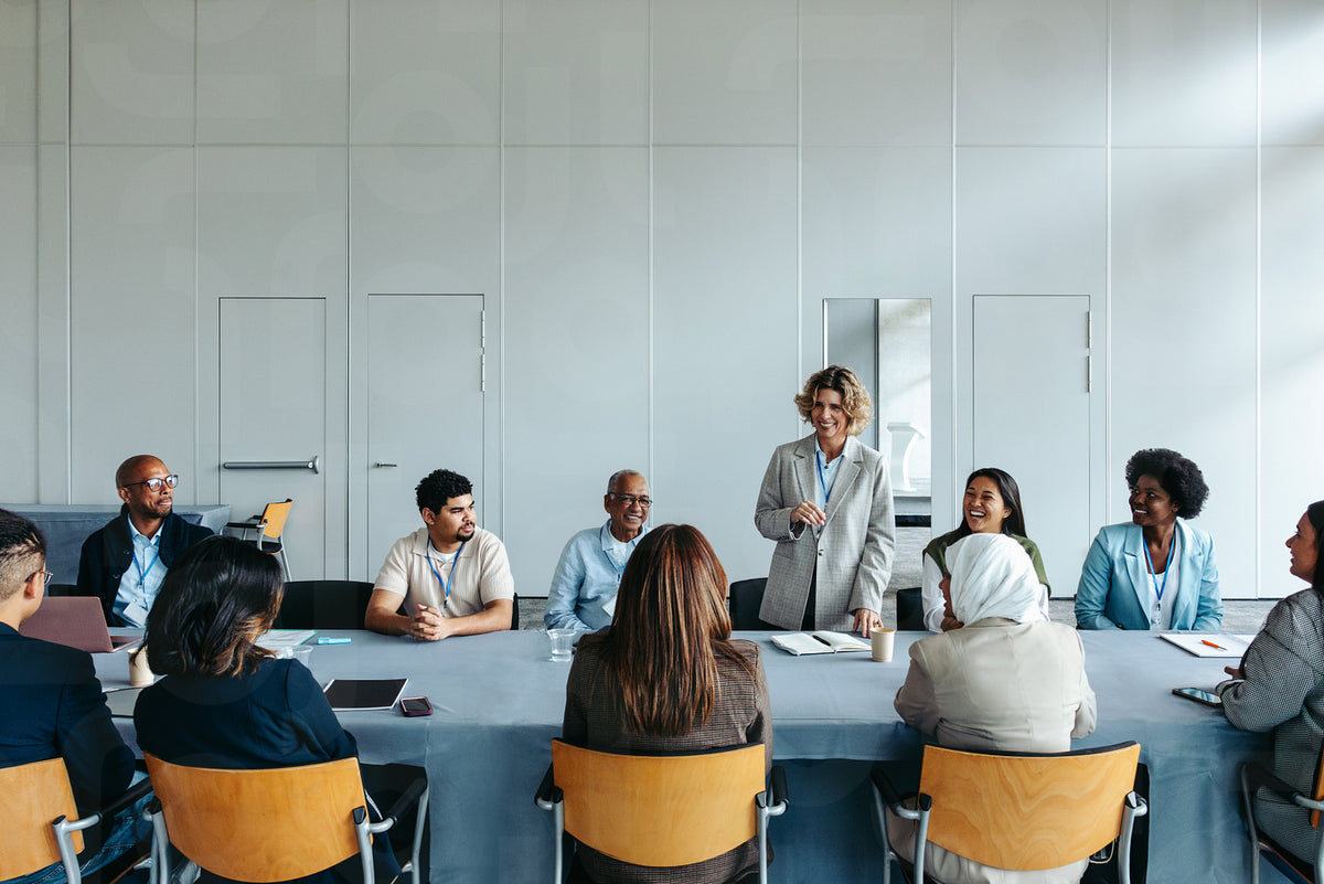 Mature female leader addressing team during business meeting – Jacob ...
