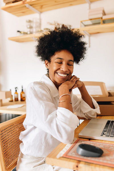 Happy Jewelry business owner in office