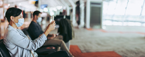 Traveler video calling while waiting at airport
