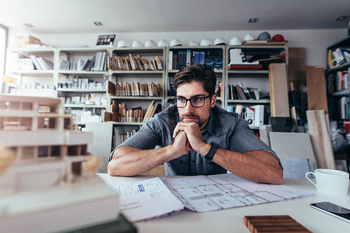 Young architect thinking about new construction ideas