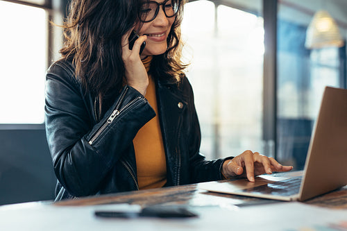 Woman in casuals working in office