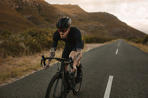 Male bicycle rider doing uphill ride