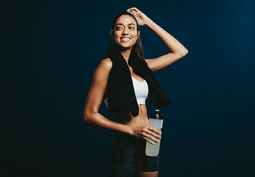 Sportswoman taking a break after exercising