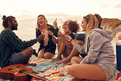 Happy friends partying on the beach 