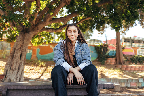 Young teenage girl looking at the camera outdoors