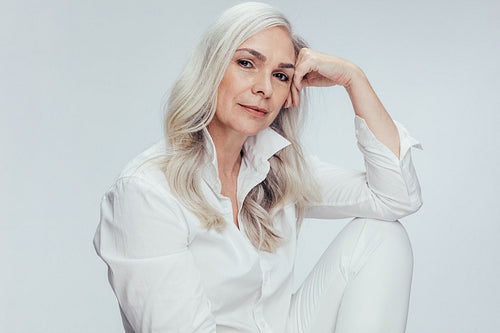 Senior woman over white background