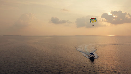 A serene sunset parasailing adventure over the open ocean
